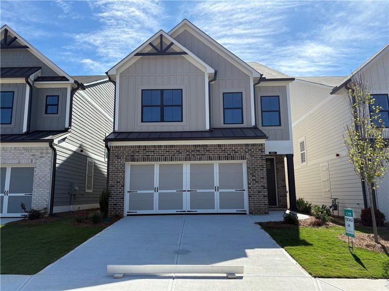 Front exterior of a new home in , Marietta, GA, highlighting curb appeal (Image 1).