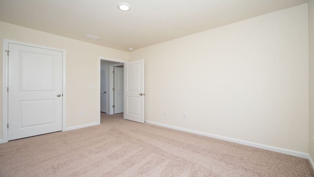 Spacious, unfurnished interior of a new home in The Pines at Blake Farm, Wilmington (Image 25).
