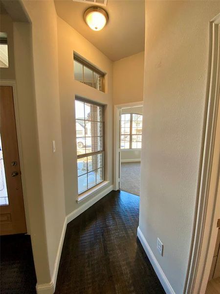 Hallway off entry with large window leading to bed 2