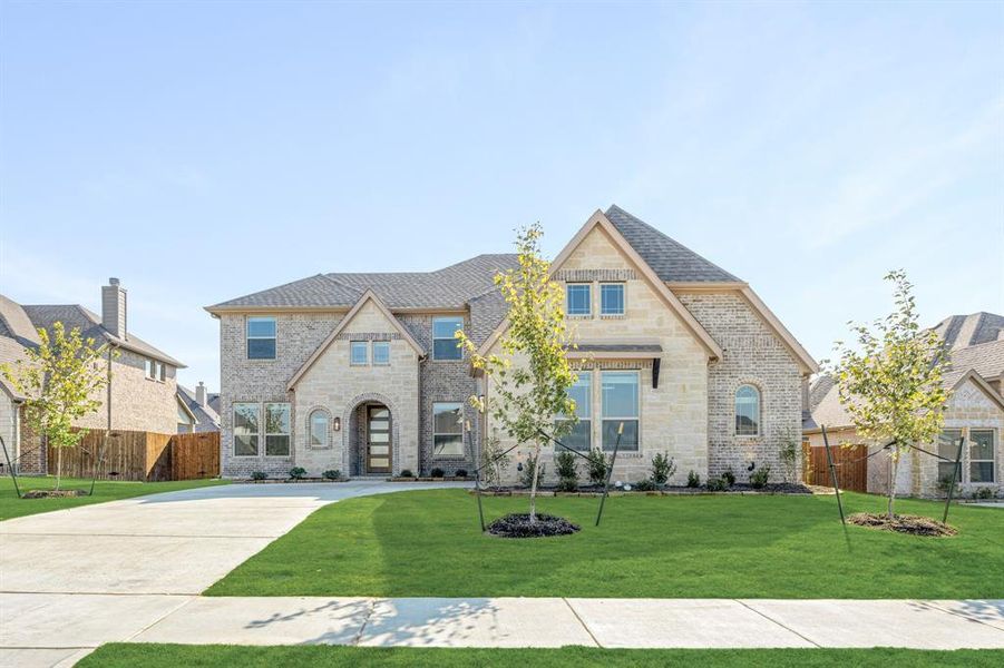 Front exterior of a new home in Ridgepoint, Midlothian, TX, highlighting curb appeal (Image 2).