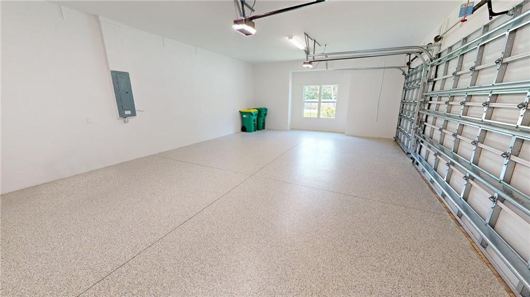 Three-car attached garage with epoxy floor Three-car attached garage with epoxy floor