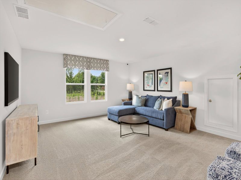 The upstairs loft is perfect for a lounge area or movie room.