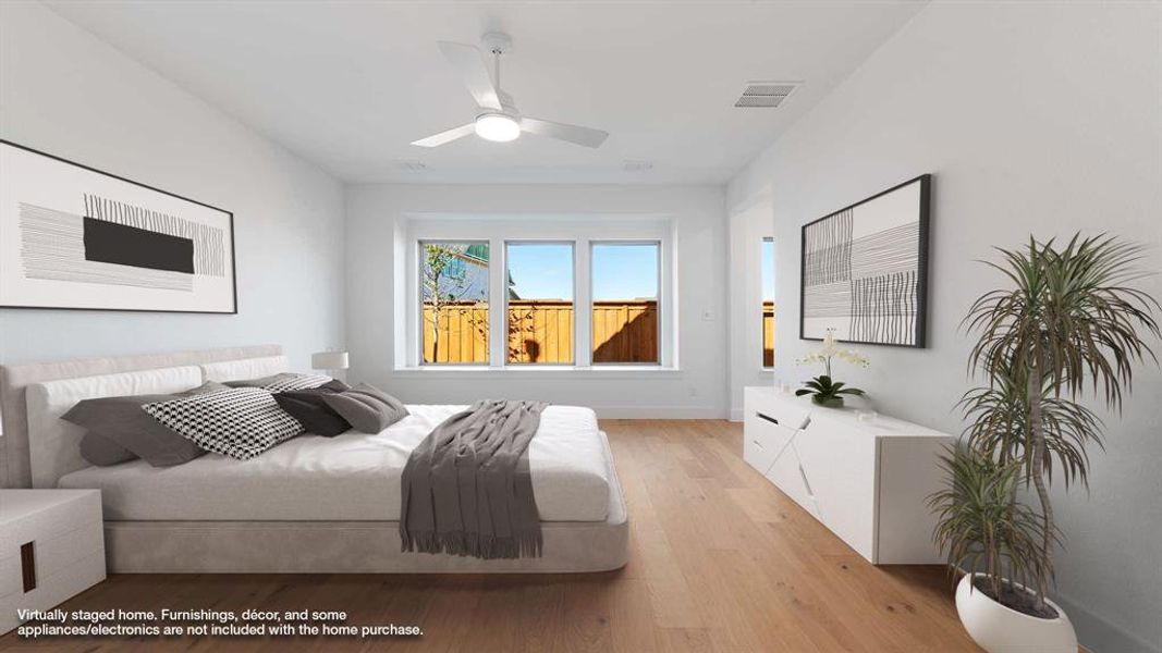 Bedroom with ceiling fan and light hardwood / wood-style flooring