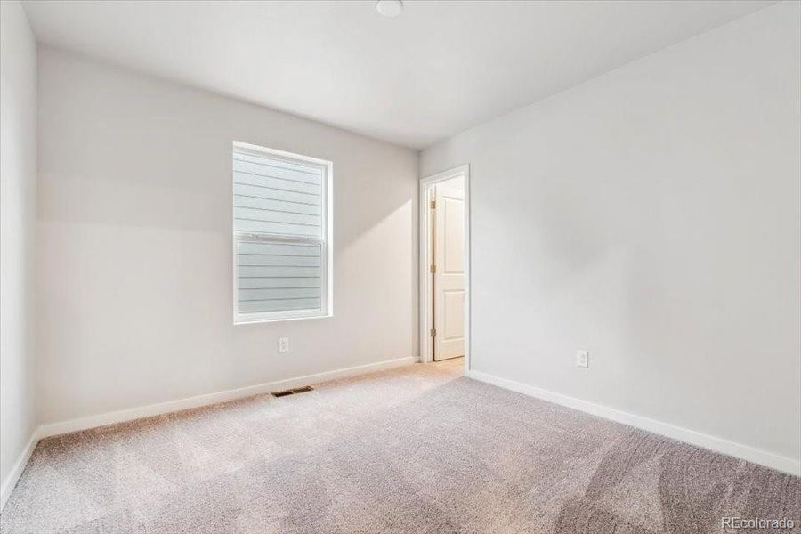 Spacious, unfurnished interior of a new home in The Haven II Collection  at Painted Prairie, Aurora (Image 16).