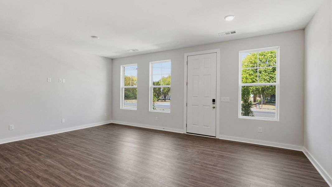 Front door with windows into spacious entryway
