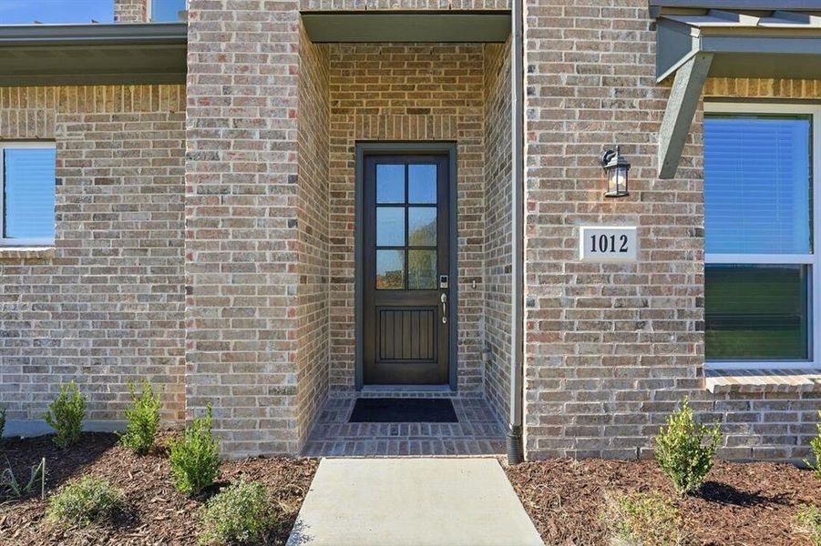Exterior details and patio area of a home in The Ranch at Uptown Celina 40s, Celina (Image 3). Exterior details and patio area of a home in The Ranch at Uptown Celina 40s, Celina (Image 3).
