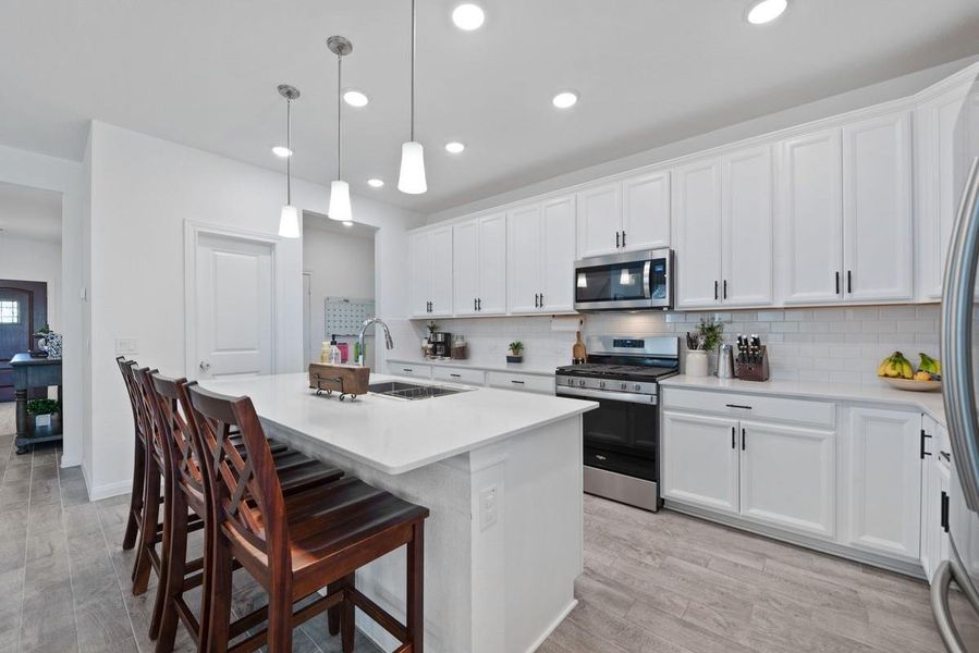 Island makes for a wonderful meal prep area and serving space. Island makes for a wonderful meal prep area and serving space.