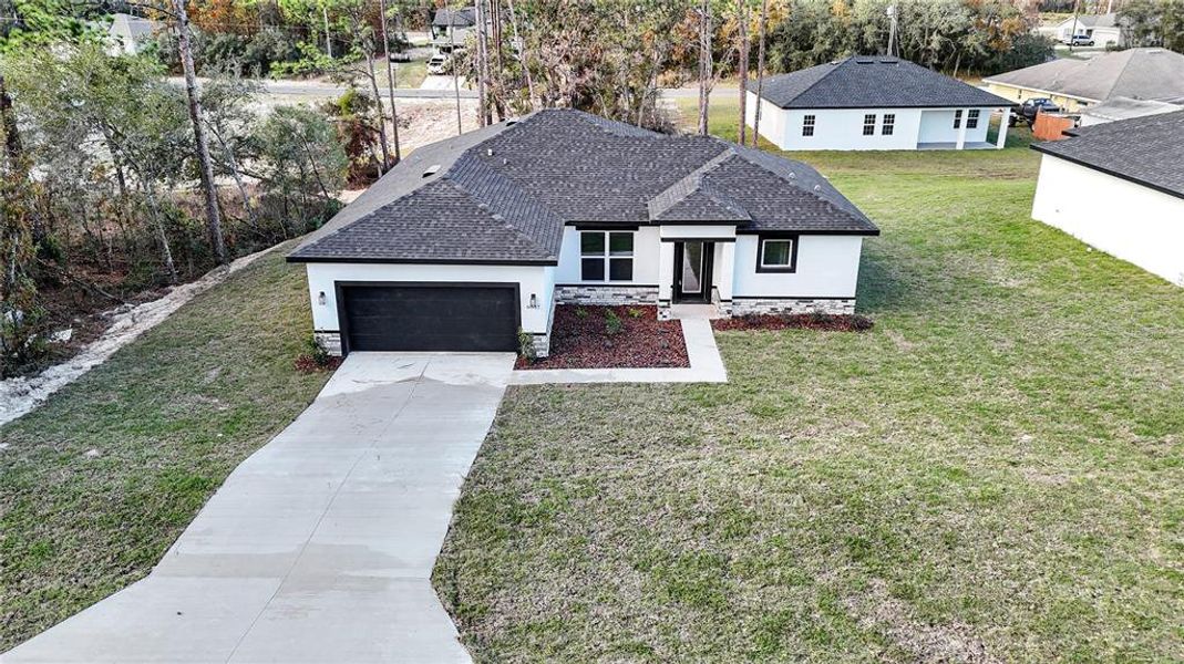 Front exterior of a new home in , Ocala, FL, highlighting curb appeal (Image 20). Front exterior of a new home in , Ocala, FL, highlighting curb appeal (Image 20).
