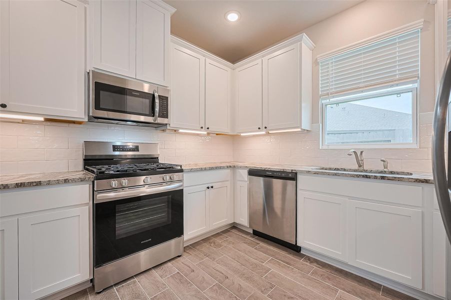 Furnished interior view inside a new home in Sunterra, Katy (Image 12).