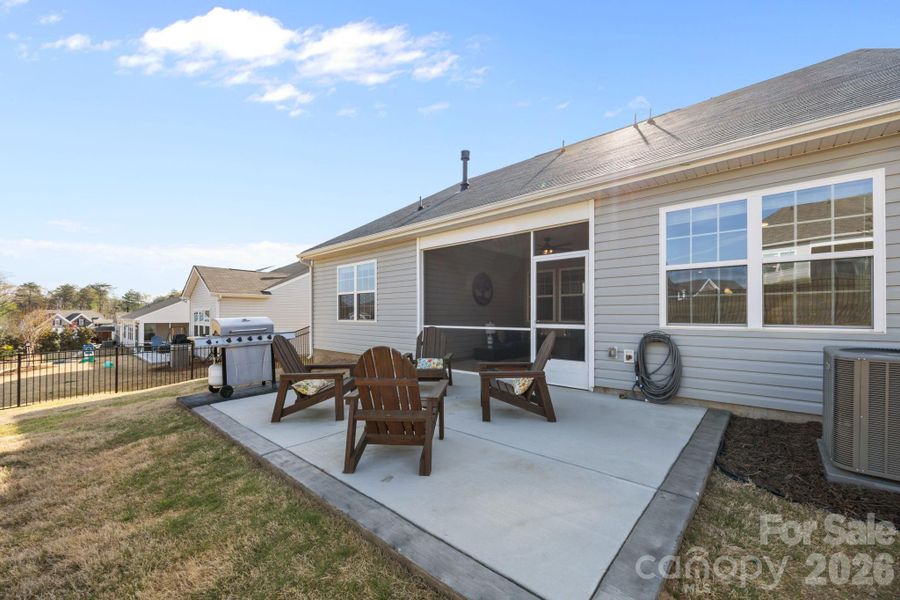 Entertain and enjoy starlit nights on your outdoor patio, just off the fully screened back porch.