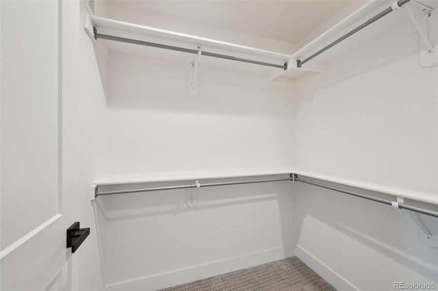 Primary bedroom suite walk in closet