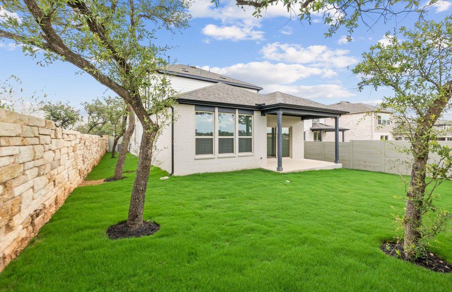 Front exterior of a new home in Wolf Ranch, Georgetown, TX, highlighting curb appeal (Image 27).