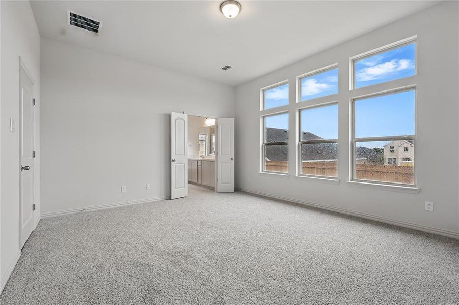 Unfurnished bedroom with light colored carpet Unfurnished bedroom with light colored carpet