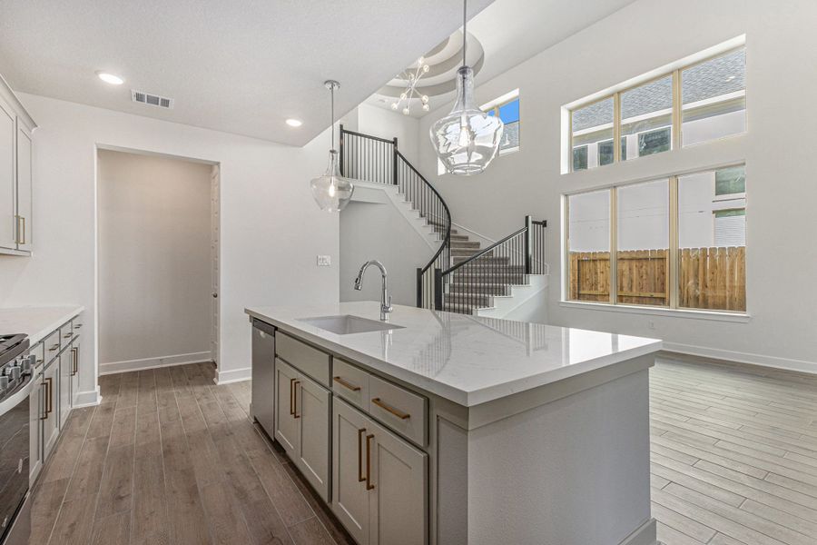 Modern Island Kitchen w/view of Winding Staircase & Rotunda Ceiling