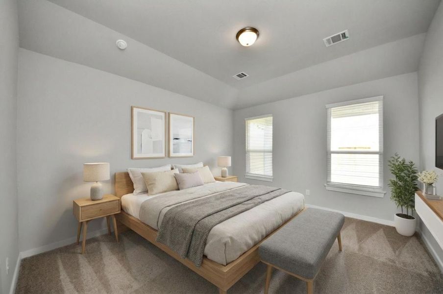 Virtually Staged -Escape and relax in the exquisite primary suite, a haven to unwind after a long day. The spacious room, located on first floor, boasts plush carpeting, soothing paint tones, high ceilings, and expansive windows adorned with privacy blinds. Sample photo of completed home with similar floor plan. Actual colors and selections may vary.