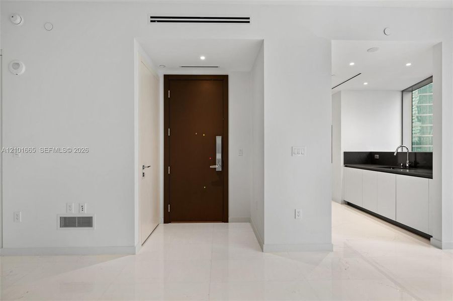 Spacious, unfurnished interior of a new home in Aston Martin Residences, Miami (Image 18).