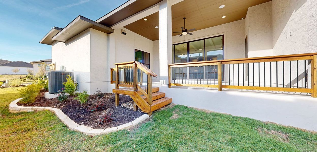 Exterior details and patio area of a home in El Sonido at Campanas, San Antonio (Image 26).