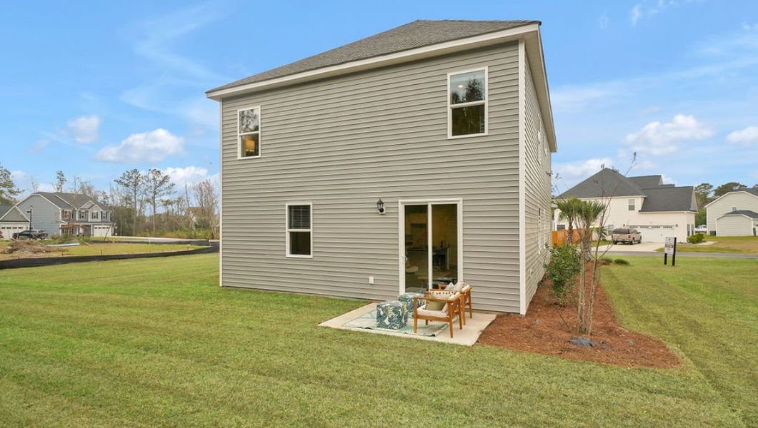 Representative exterior details of a home built from the WOODSTOCK by D.R. Horton in Surfside Landing, Hubert (Image 2).