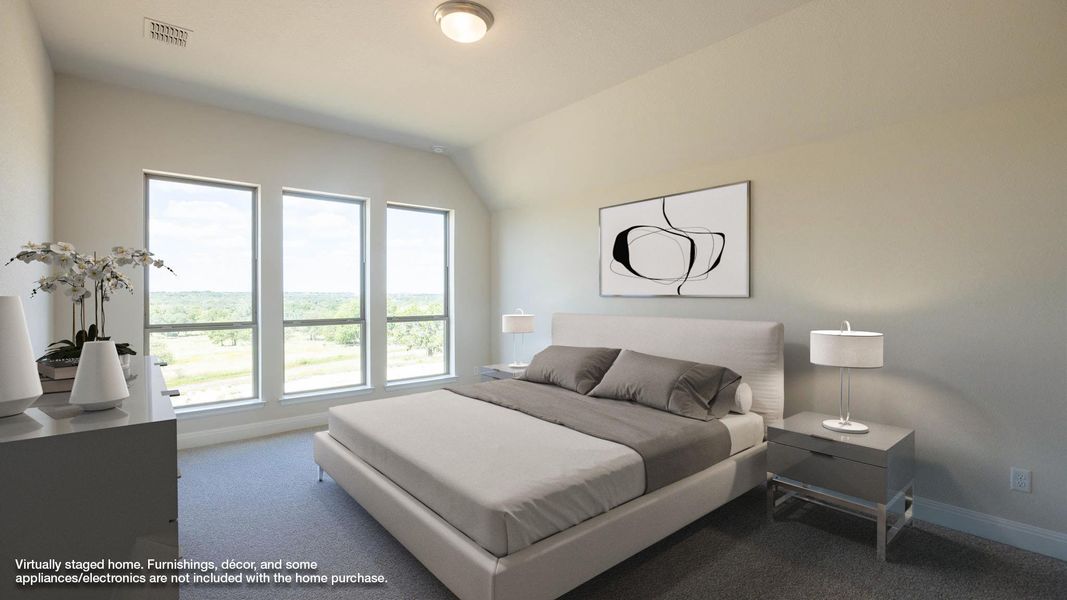 Bedroom featuring carpet and lofted ceiling Bedroom featuring carpet and lofted ceiling