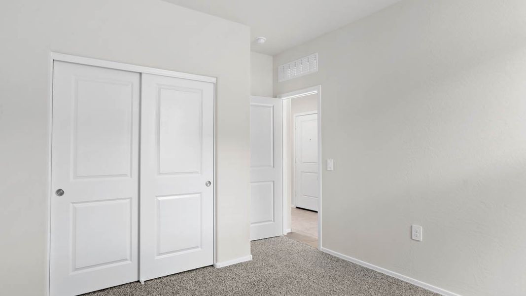 Representative unfurnished interior of a home built from the McCormick by D.R. Horton in Rio Rancho Estates, Surprise (Image 15).