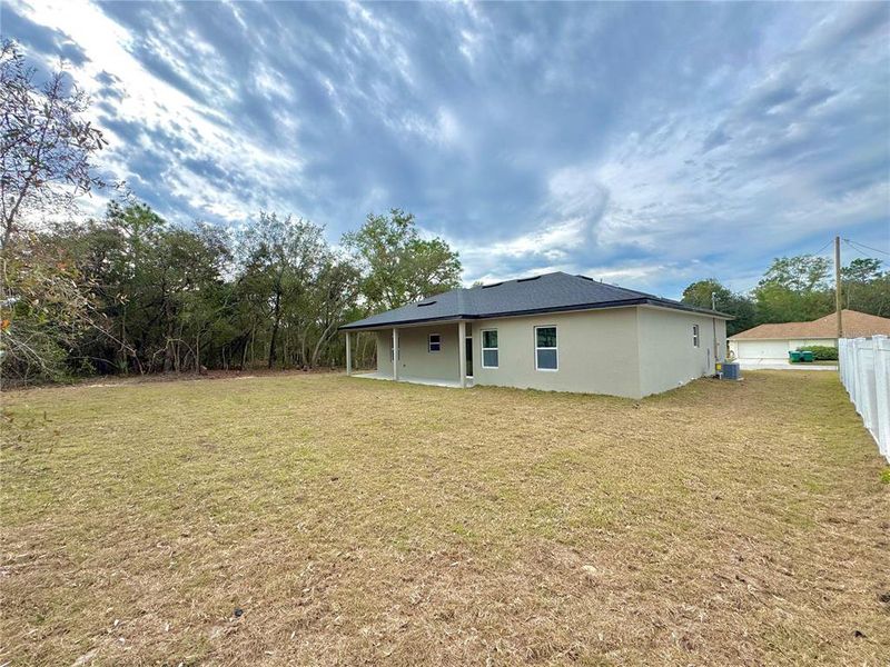 Exterior details and patio area of a home in , Citrus Springs (Image 18).