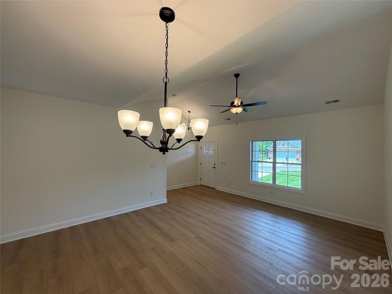 Neutral paint and wide open space! This is a view from the dining area into the family room.
