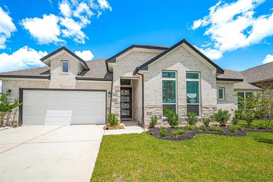 Front exterior of a new home in Lago Mar, La Marque, TX, highlighting curb appeal (Image 24).