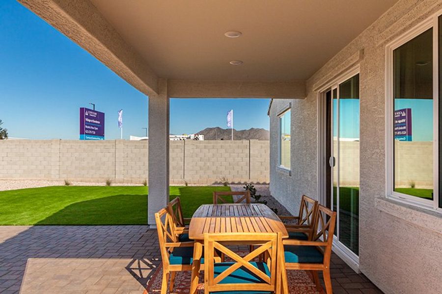 A patio with a table and chairs. A patio with a table and chairs.