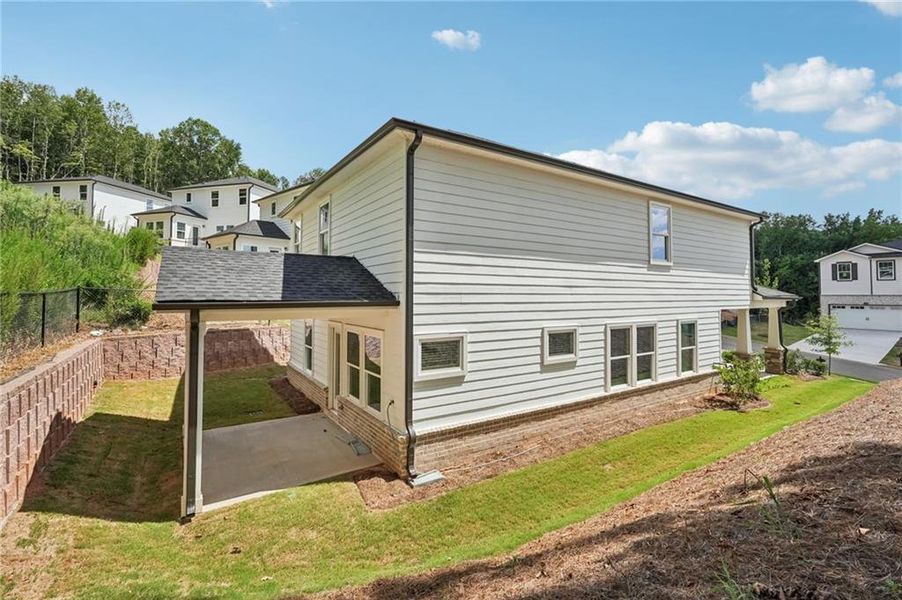 Exterior details and patio area of a home in Hemingway - Reserve Series, Cumming (Image 2). Exterior details and patio area of a home in Hemingway - Reserve Series, Cumming (Image 2).