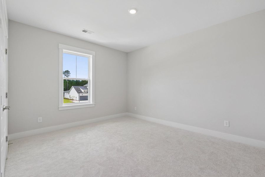 Spacious, unfurnished interior of a new home in Hidden Ponds Reserve, Awendaw (Image 43).