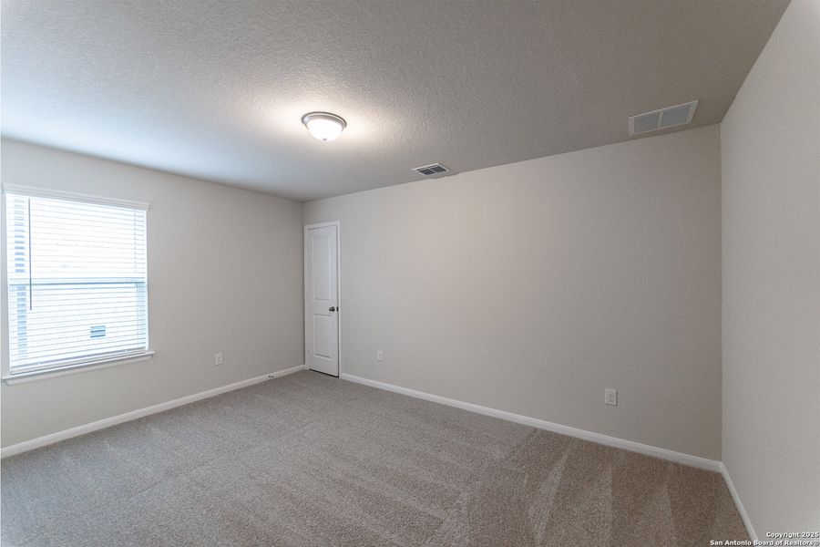 Spacious, unfurnished interior of a new home in The Woodlands at Medina Hills, Mico (Image 19).