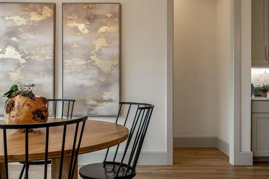 Dining area featuring light wood finished floors and baseboards