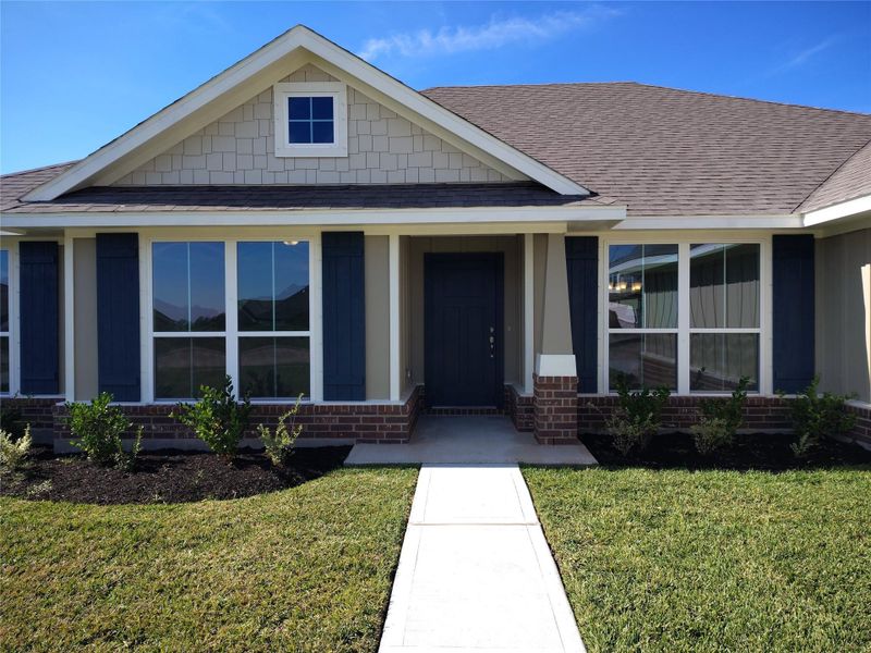 Front exterior of a new home in Greystone, Angleton, TX, highlighting curb appeal (Image 2). Front exterior of a new home in Greystone, Angleton, TX, highlighting curb appeal (Image 2).