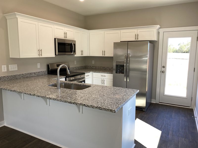 Representative furnished interior of a home built from the Tyler II by Foundation Home Builders LLC in Pinnix Loop, Burlington (Image 5).