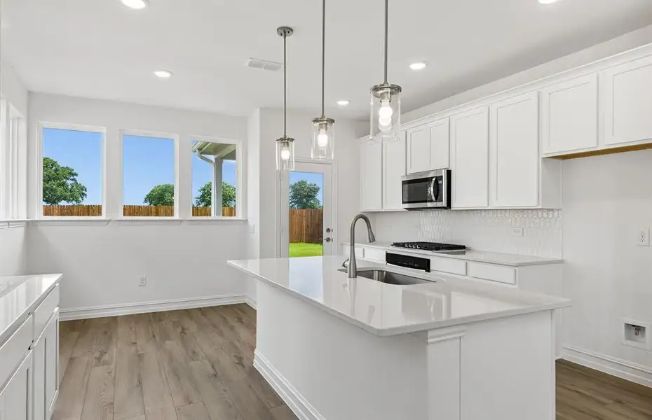 *Floorplan representation, not actual home - Large island overlooking gathering room and dining areas