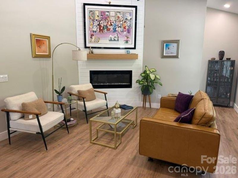 Open Concept Main Floor Fireplace is electric with a Heating element Open Concept Main Floor Fireplace is electric with a Heating element