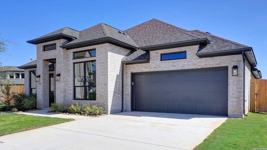 Front exterior of a new home in Alsatian Oaks, Castroville, TX, highlighting curb appeal (Image 2).