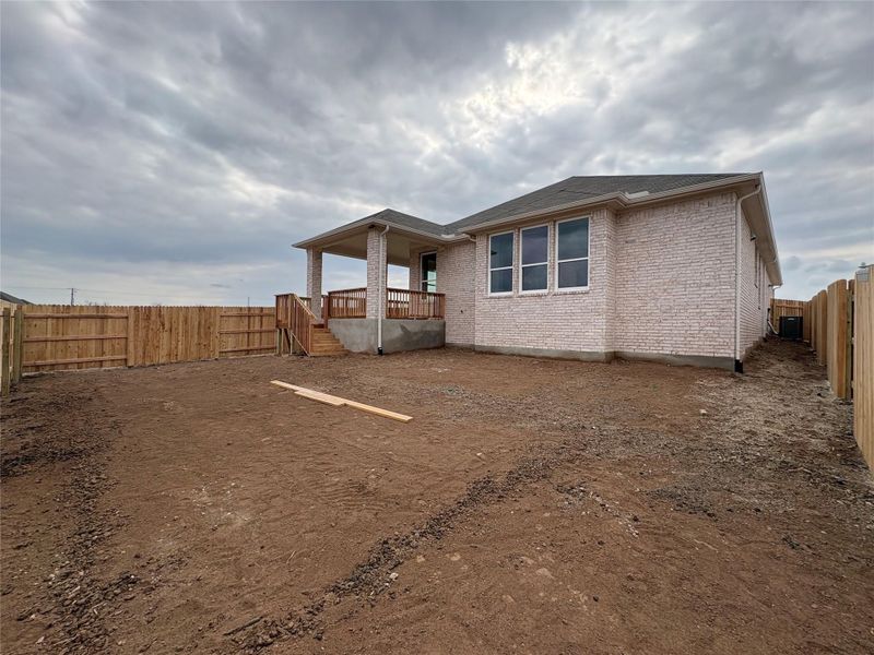 Exterior details and patio area of a home in Willow Springs, Buda (Image 18).