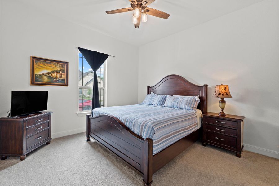 Located at the front of the home, this bedroom is light and bright.