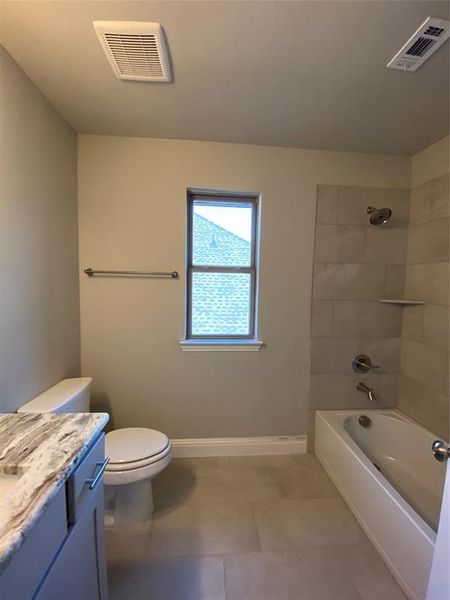 Bath 2 is shared by bed 2 & 3. Features window, 12x24 tile, and Granite counters Bath 2 is shared by bed 2 & 3. Features window, 12x24 tile, and Granite counters