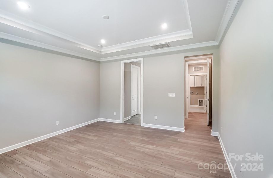 Primary Bedroom with View of Closet and Bathroom-Photo similar to Subject Property