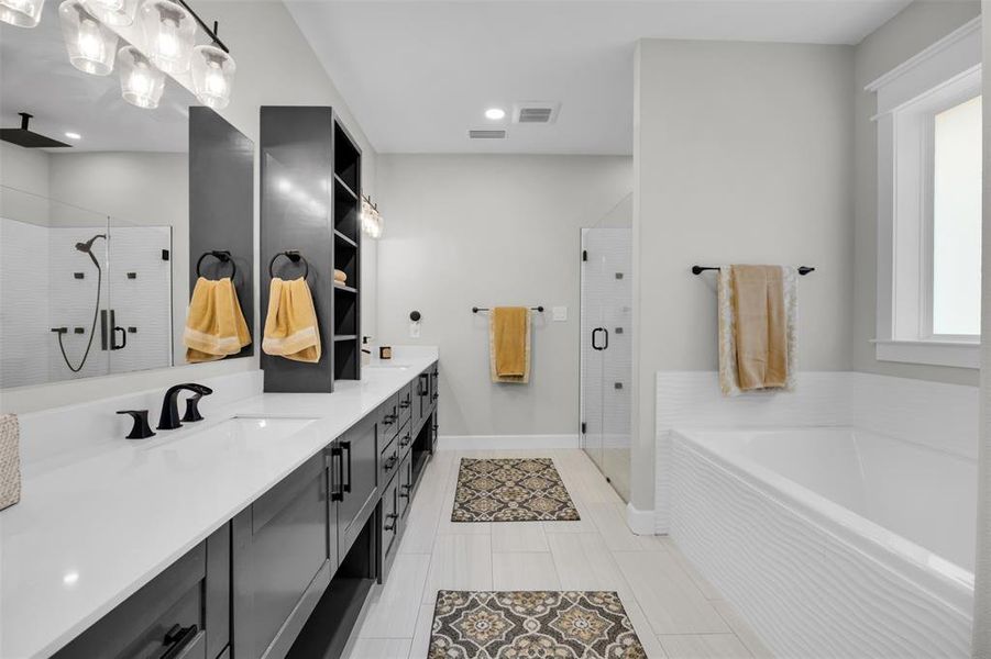 Bathroom with vanity and shower with separate bathtub