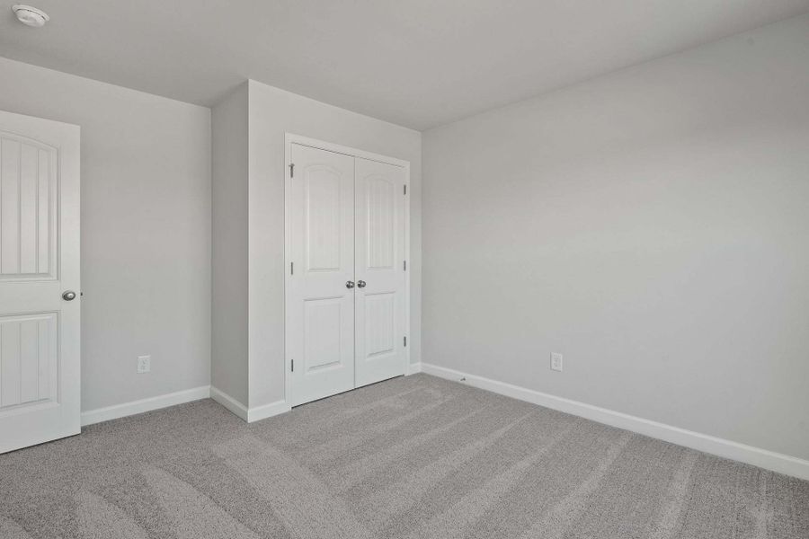 Representative unfurnished interior of a home built from the Camellia by Caviness & Cates Communities in Bartlett Manor, Youngsville (Image 110).