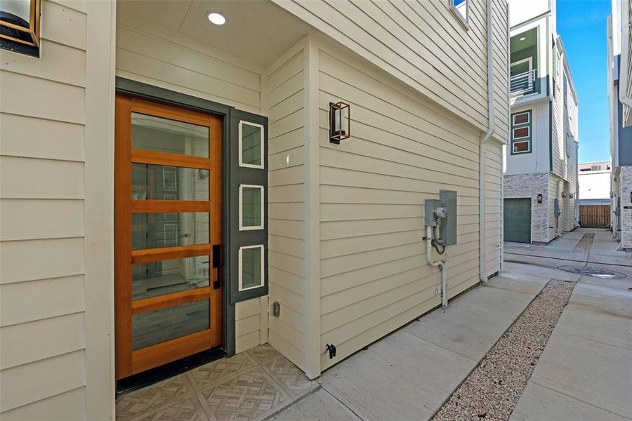 The home's front door and sidelights add architectural interest to the entryway.