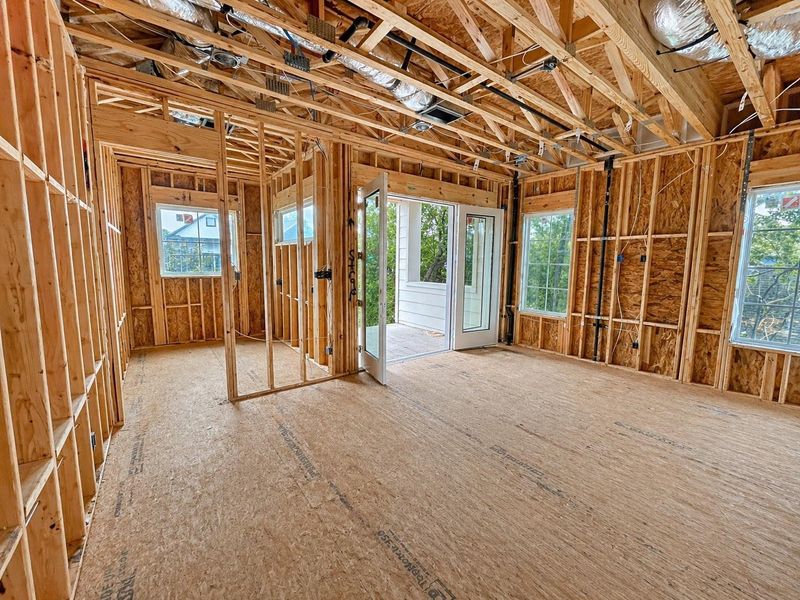 The study is in the front of the home and next to the balcony.
