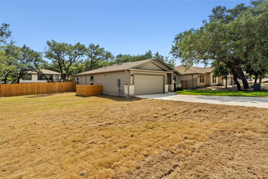 Large space to the left of the house, which could be used for boat/RV storage or incorporated into the backyard to make that space bigger. The grass is now much greener :)