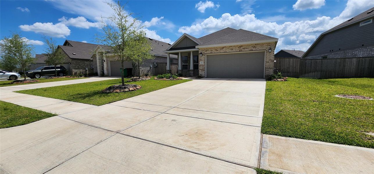 Front exterior of a new home in Anniston, Katy, TX, highlighting curb appeal (Image 27).