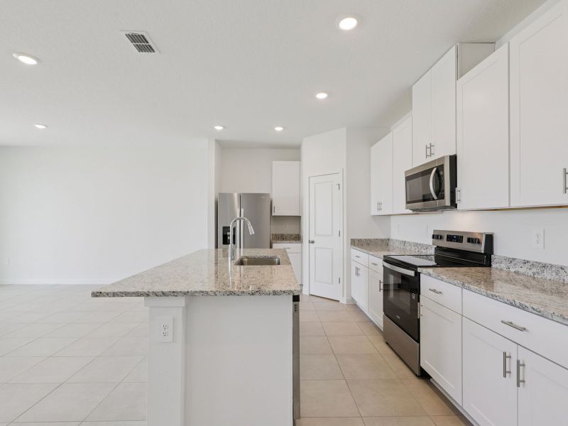 Furnished interior view inside a new home in Lakes at Bella Lago - Signature Series, Green Cove Springs (Image 6).