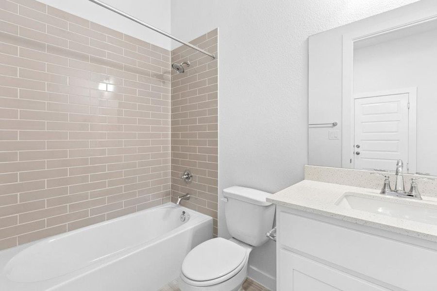 Full bath with vanity and shower / bath combination