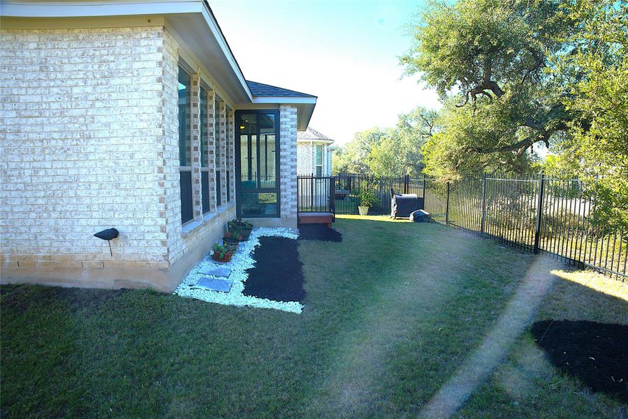 View of yard featuring a sunroom View of yard featuring a sunroom